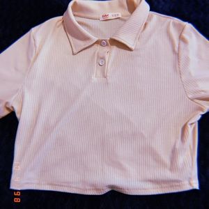 Cropped tan collared shirt.